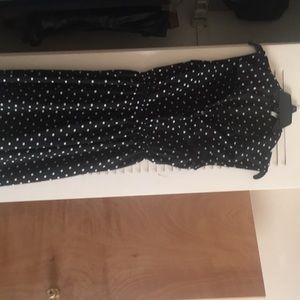 Sleeveless polka dots dress. Button down to waist